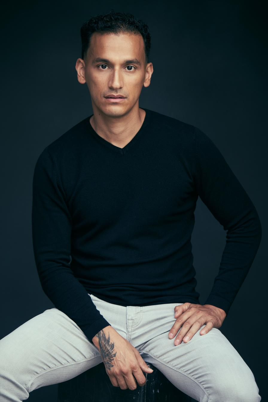 Goya Robles seated in black sweater