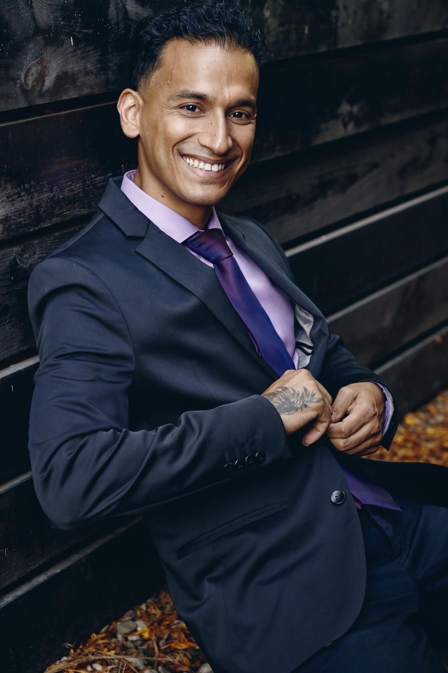 Goya Robles in a suit, close portrait