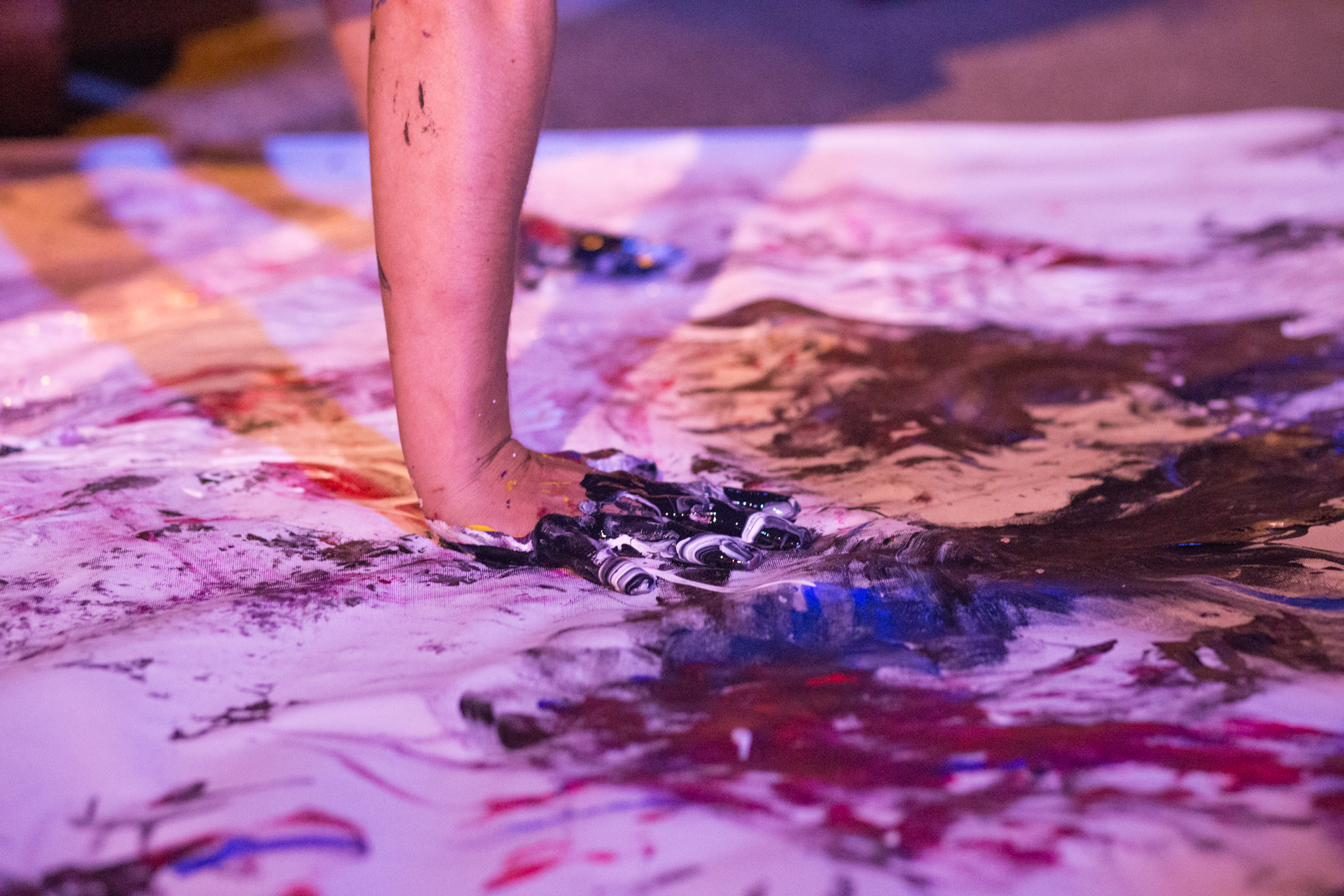 Paint The Mic — a dancer's feet moving through wet paint